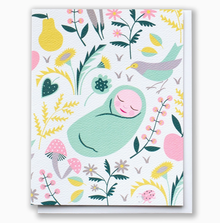 Greeting card with a green baby swaddle and floral design on a white background